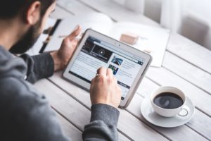 Man typing on a tablet