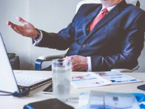 Man in costume sitting on desk