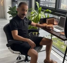 Bashar J Katou sitting on chair